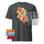 Dark gray kawaii character t-shirt featuring cute colorful cartoon faces sitting on couch with laptop