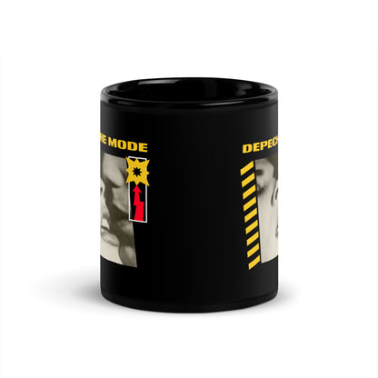 Black mug with yellow text and vintage black and white faces design A Question of Lust coffee cup
